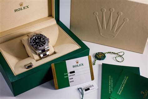 rolex box and paper.